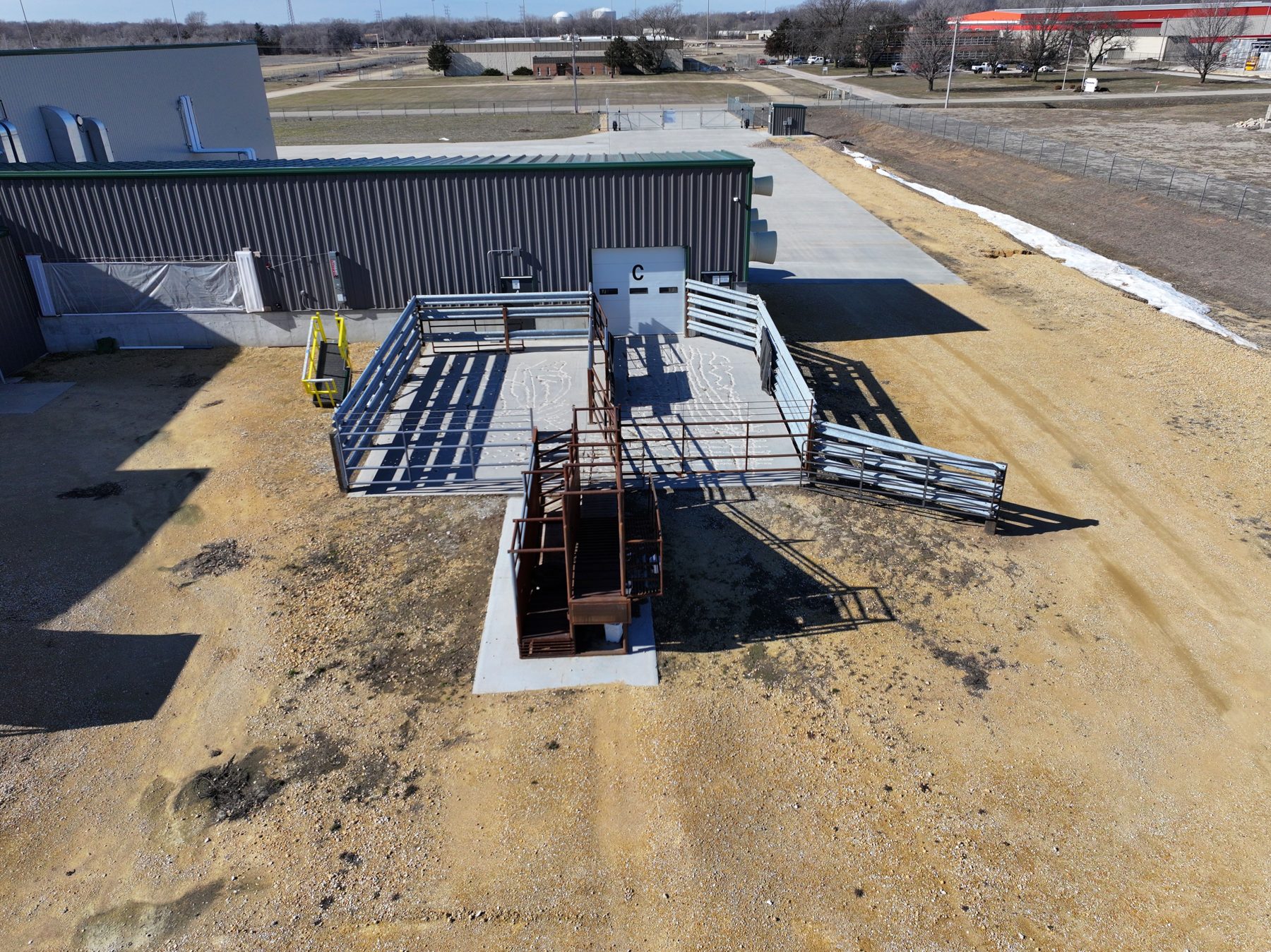 Livestock receiving alley with steel gating leading toward the plant