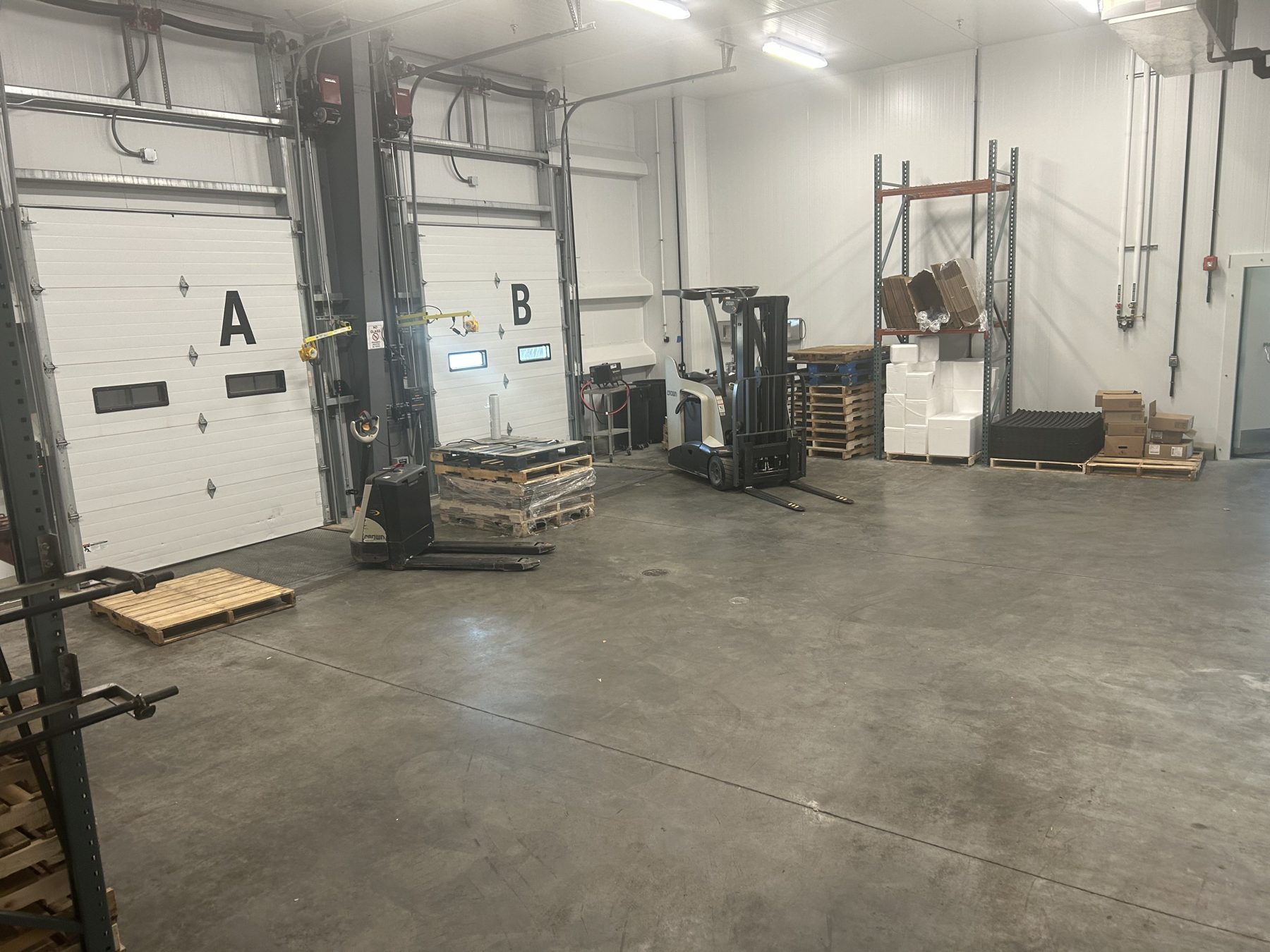 Interior shipping dock with dock doors and staging area